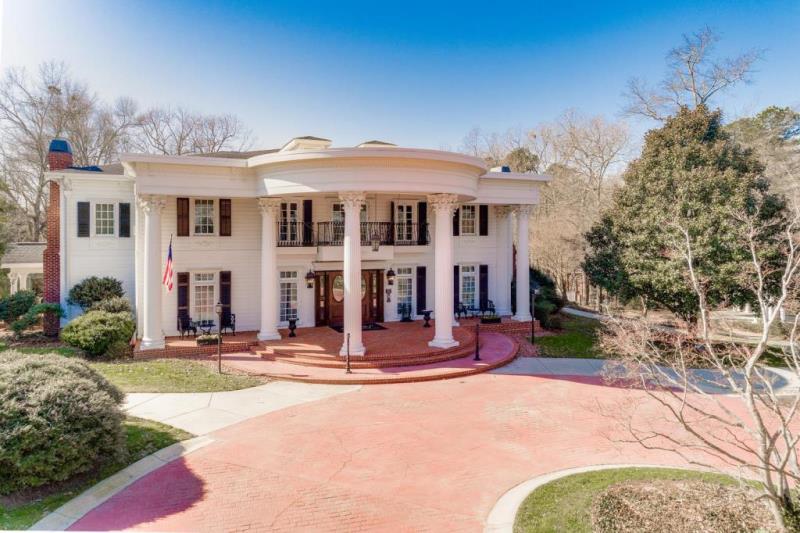 This Inn, a 10,000 square foot southern mansion set on 6+ wooded acres, designed and built by the owner and her family, has the feel of times past